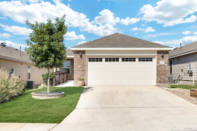 ranch-style home with central AC, a front lawn, and a garage