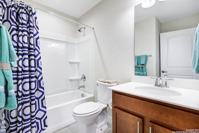 full bathroom with vanity, shower / tub combo with curtain, toilet, and tile patterned flooring