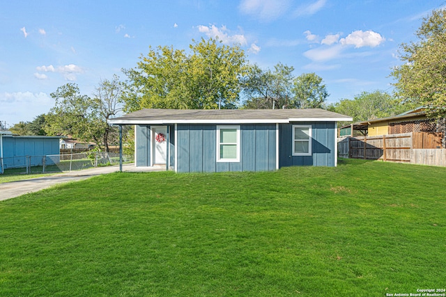 view of outbuilding with a yard