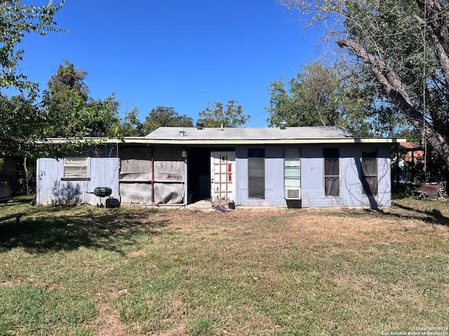 view of outdoor structure featuring a lawn