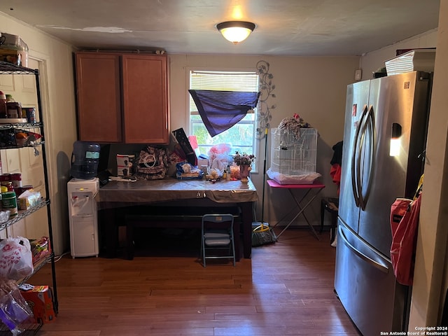 kitchen featuring dark hardwood / wood-style floors and stainless steel refrigerator