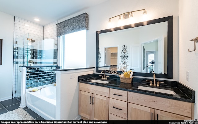 bathroom featuring vanity, plus walk in shower, tile patterned flooring, and plenty of natural light