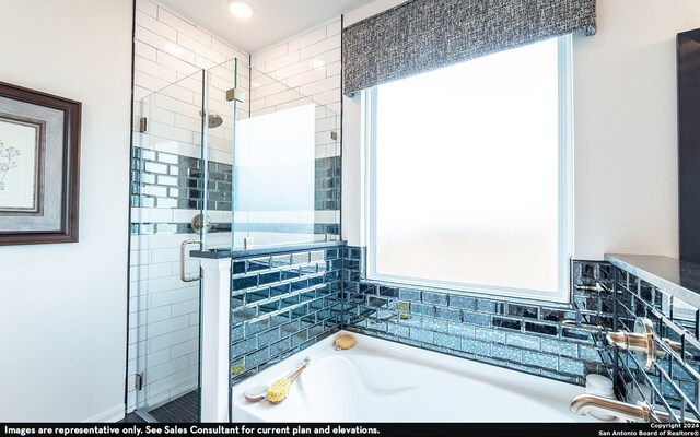 bathroom with separate shower and tub