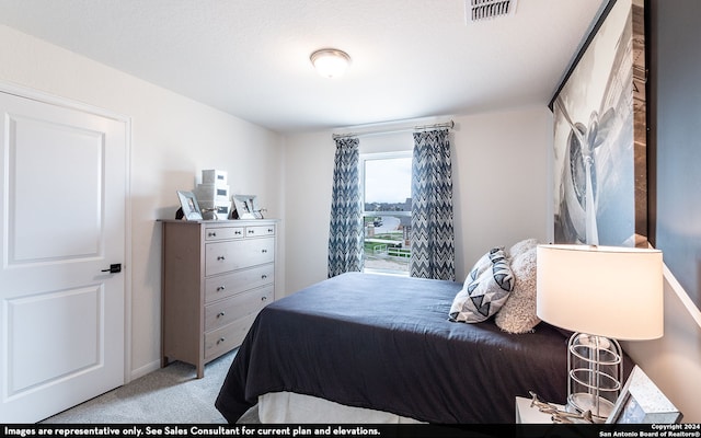 bedroom with light carpet