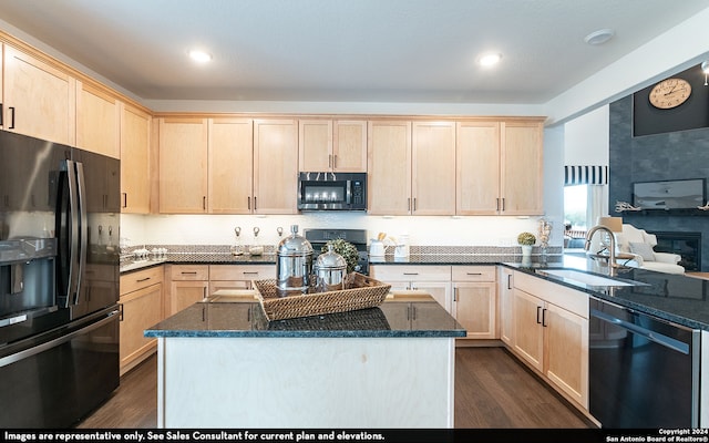 kitchen featuring dark wood-type flooring, light brown cabinetry, black appliances, and sink