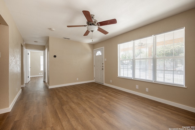 foyer entrance with wood-type flooring and ceiling fan