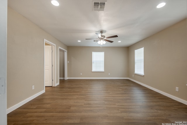 empty room featuring ceiling fan and dark hardwood / wood-style floors