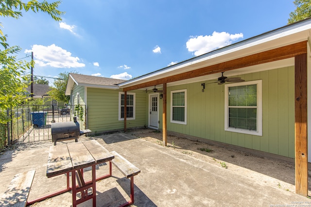 rear view of house featuring a patio and ceiling fan