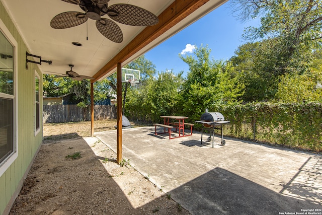 view of patio with area for grilling and ceiling fan