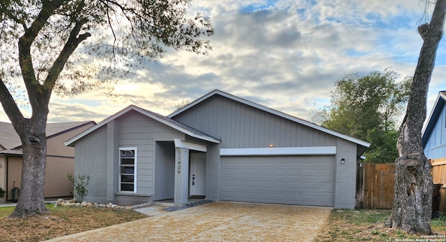 single story home with a garage