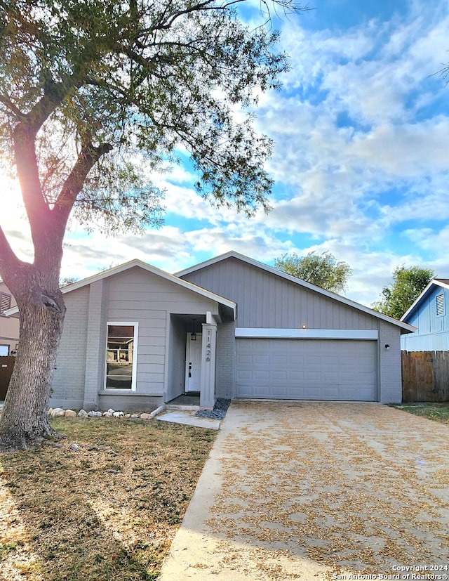 ranch-style home featuring a garage