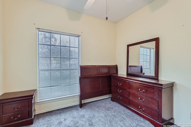 bedroom featuring light carpet and ceiling fan