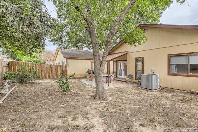 view of yard featuring a patio and central AC unit