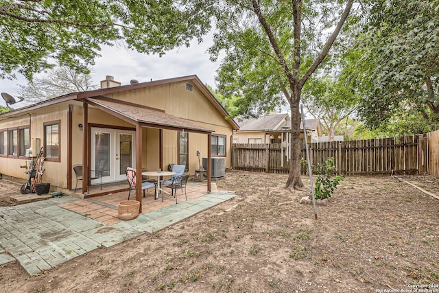 back of property featuring a patio and central AC