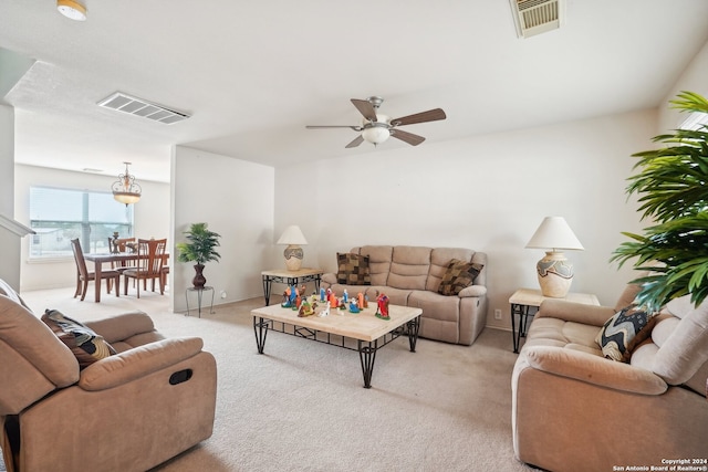 living room with light colored carpet and ceiling fan