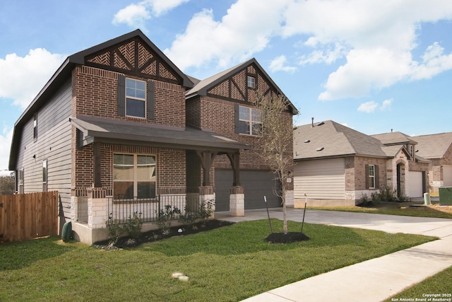 view of front of house with brick siding, covered porch, an attached garage, driveway, and a front lawn