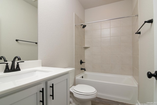 full bathroom with toilet, shower / tub combination, wood finished floors, and vanity