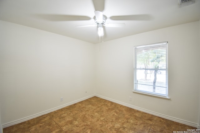 spare room featuring ceiling fan