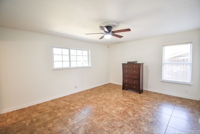 spare room with ceiling fan