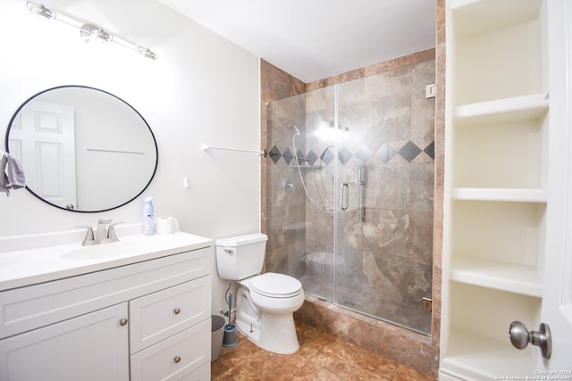 bathroom with toilet, an enclosed shower, vanity, and tile patterned flooring