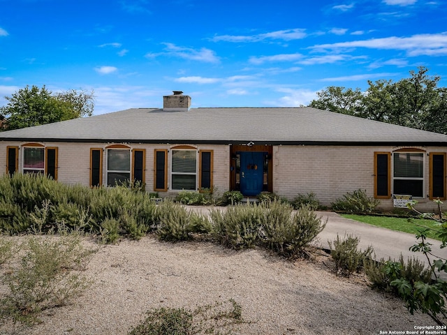 414 E Hathaway Dr, San Antonio, TX 78209 - ranch-style house with roof with shingles, a chimney, and brick siding