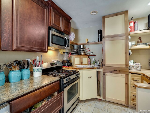 414 E Hathaway Dr, San Antonio, TX 78209 - kitchen featuring light countertops, light tile patterned flooring, appliances with stainless steel finishes, and recessed lighting
