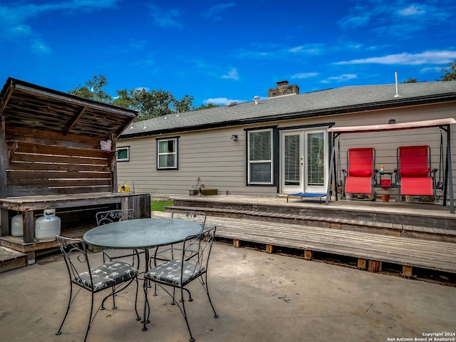 414 E Hathaway Dr, San Antonio, TX 78209 - back of property with a deck, outdoor dining area, french doors, a chimney, and a patio area