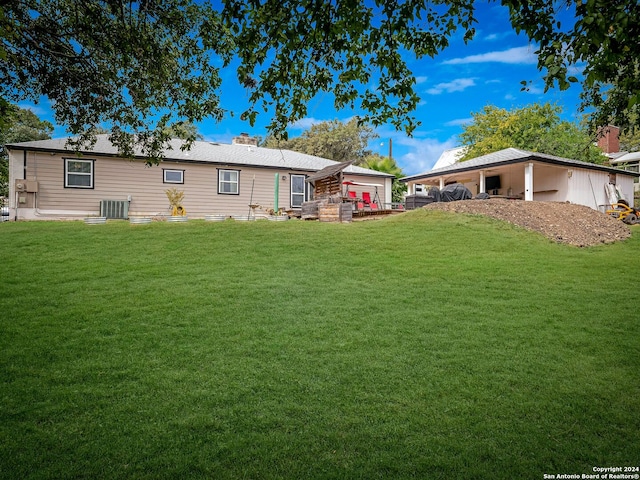 414 E Hathaway Dr, San Antonio, TX 78209 - rear view of house with central AC unit, a chimney, and a yard