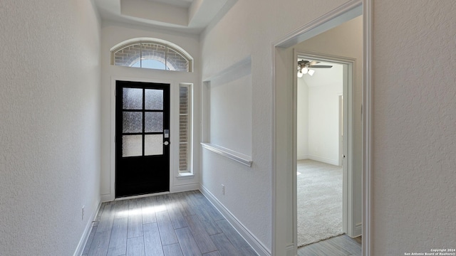 entrance foyer featuring light wood-type flooring and ceiling fan