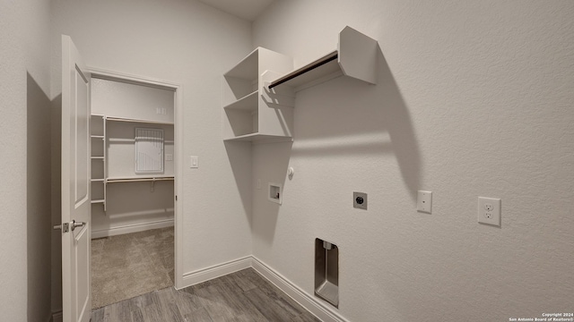 washroom with gas dryer hookup, hookup for a washing machine, wood-type flooring, and electric dryer hookup