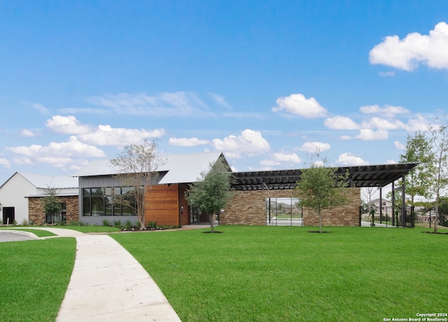 view of community featuring a lawn