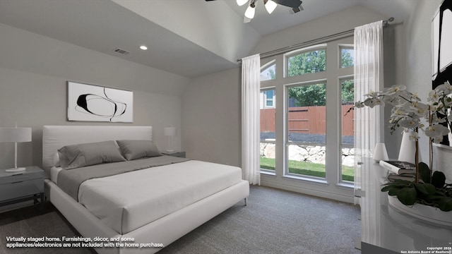 bedroom with carpet flooring, vaulted ceiling, and ceiling fan