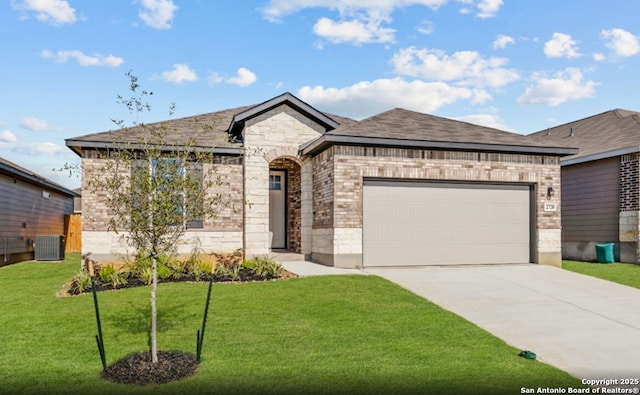 french country style house with a front yard, a garage, brick siding, concrete driveway, and stone siding