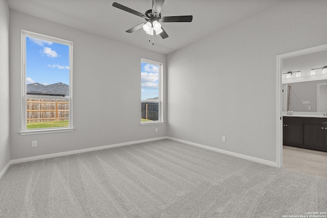 2720 Rio Primero, Seguin, TX 78155 - empty room featuring light colored carpet, a ceiling fan, and baseboards