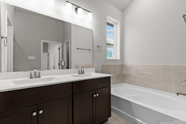 2720 Rio Primero, Seguin, TX 78155 - bathroom with a garden tub and double vanity
