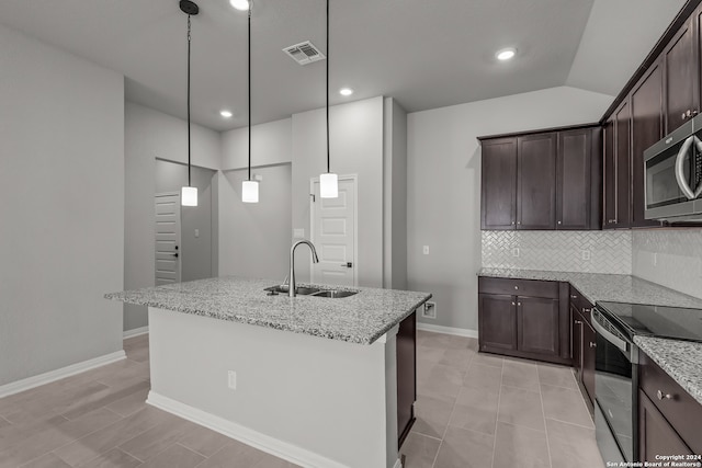 kitchen featuring electric range, visible vents, dark brown cabinets, a sink, and stainless steel microwave
