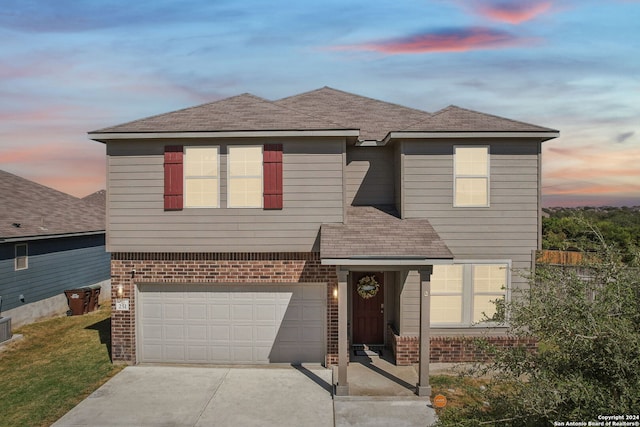 view of front of property featuring a garage