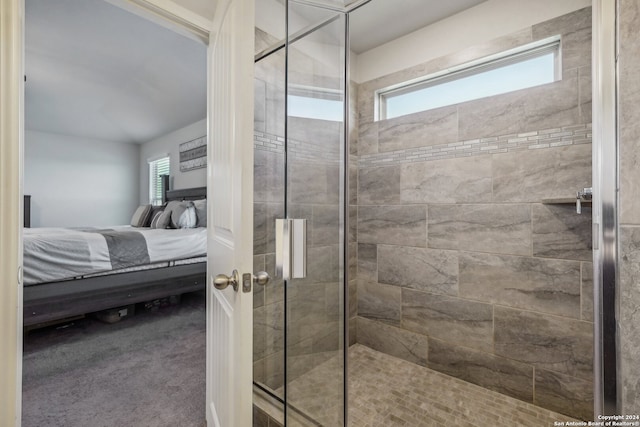 bathroom with a shower with shower door