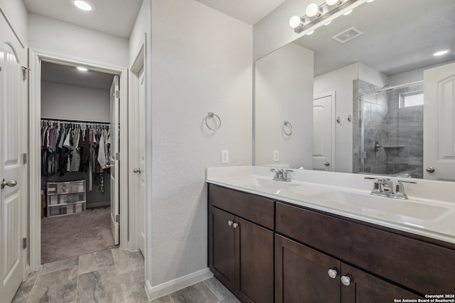 bathroom with vanity and an enclosed shower