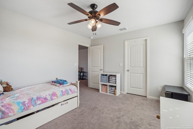 carpeted bedroom featuring ceiling fan