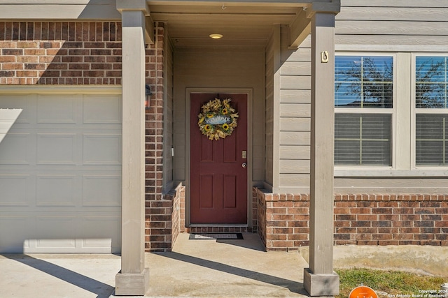 property entrance with a garage