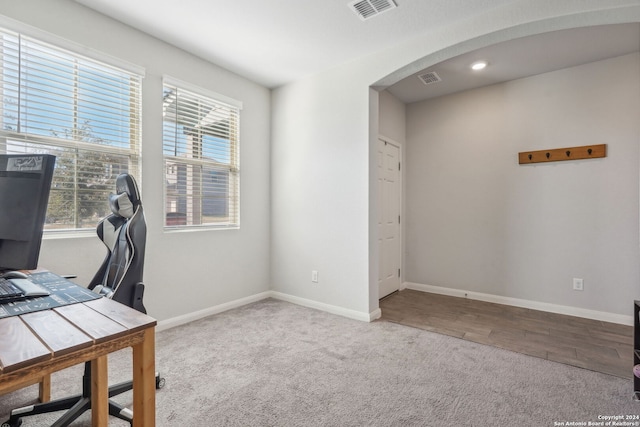 home office with hardwood / wood-style flooring