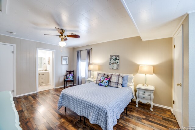 bedroom with ensuite bath, crown molding, ceiling fan, and dark hardwood / wood-style flooring