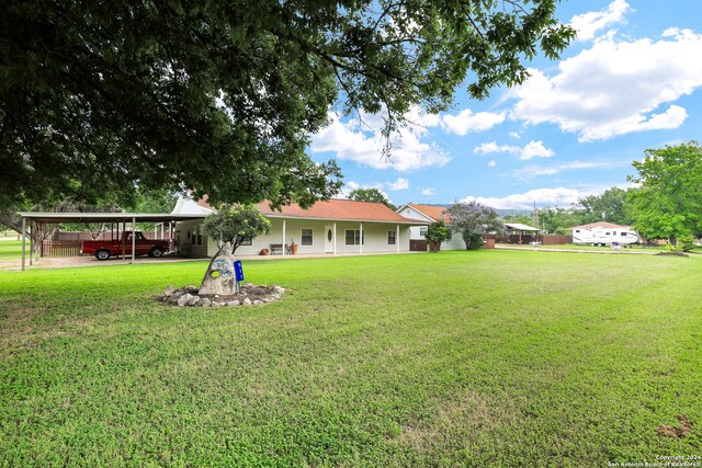 view of yard with a carport