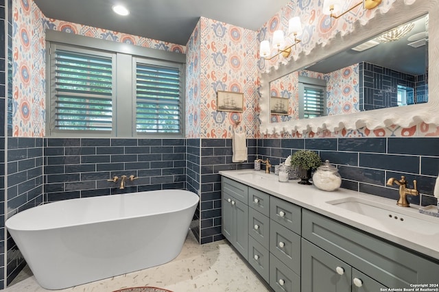 bathroom featuring vanity, tile walls, and a washtub