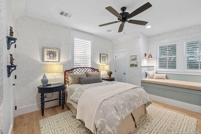 bedroom featuring light hardwood / wood-style floors and ceiling fan