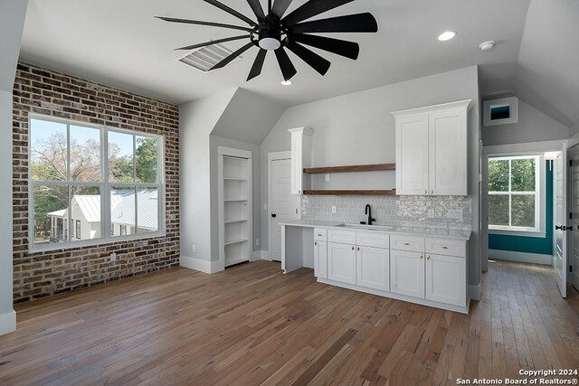 kitchen featuring white cabinetry, ceiling fan, wood-type flooring, and sink