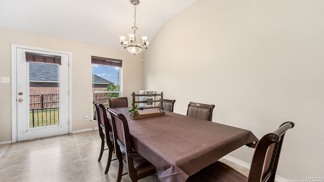 dining room with a notable chandelier, light tile patterned flooring, and vaulted ceiling