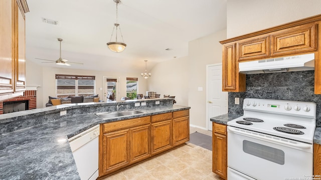 1042 Segovia, New Braunfels, TX 78130 - kitchen featuring white appliances, under cabinet range hood, ceiling fan with notable chandelier, dark countertops, and a sink