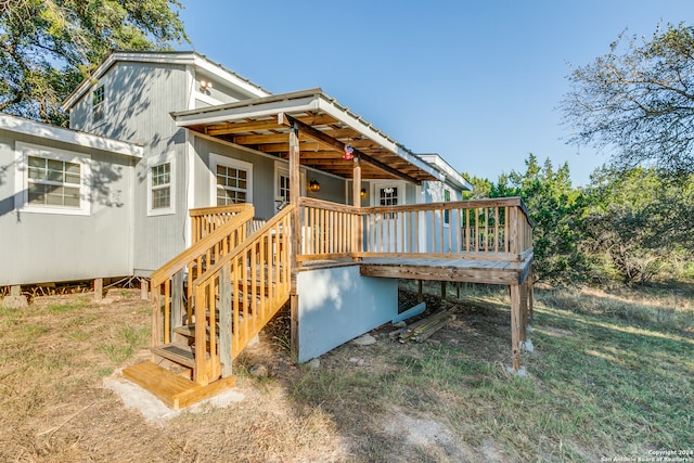 rear view of house with a deck